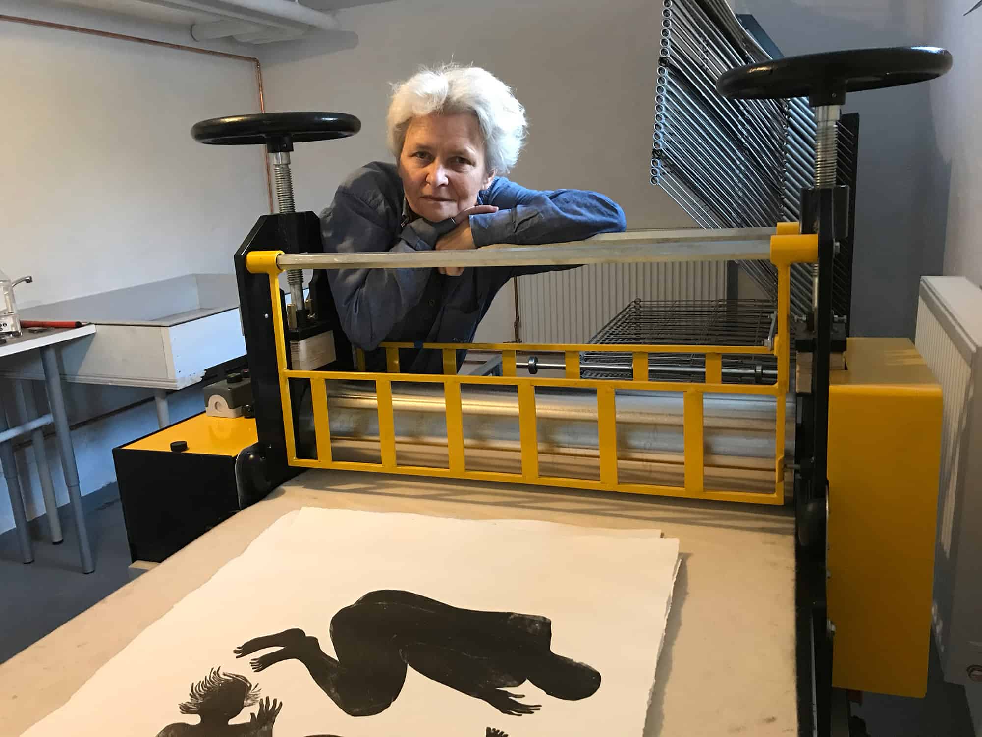 Contemporary artist Jolanta Johnsson at the graphic press in her studio